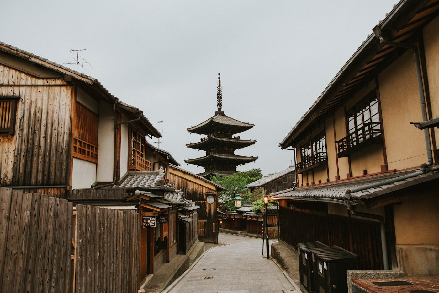 A historic wooden street in Gion with a pagoda beyond