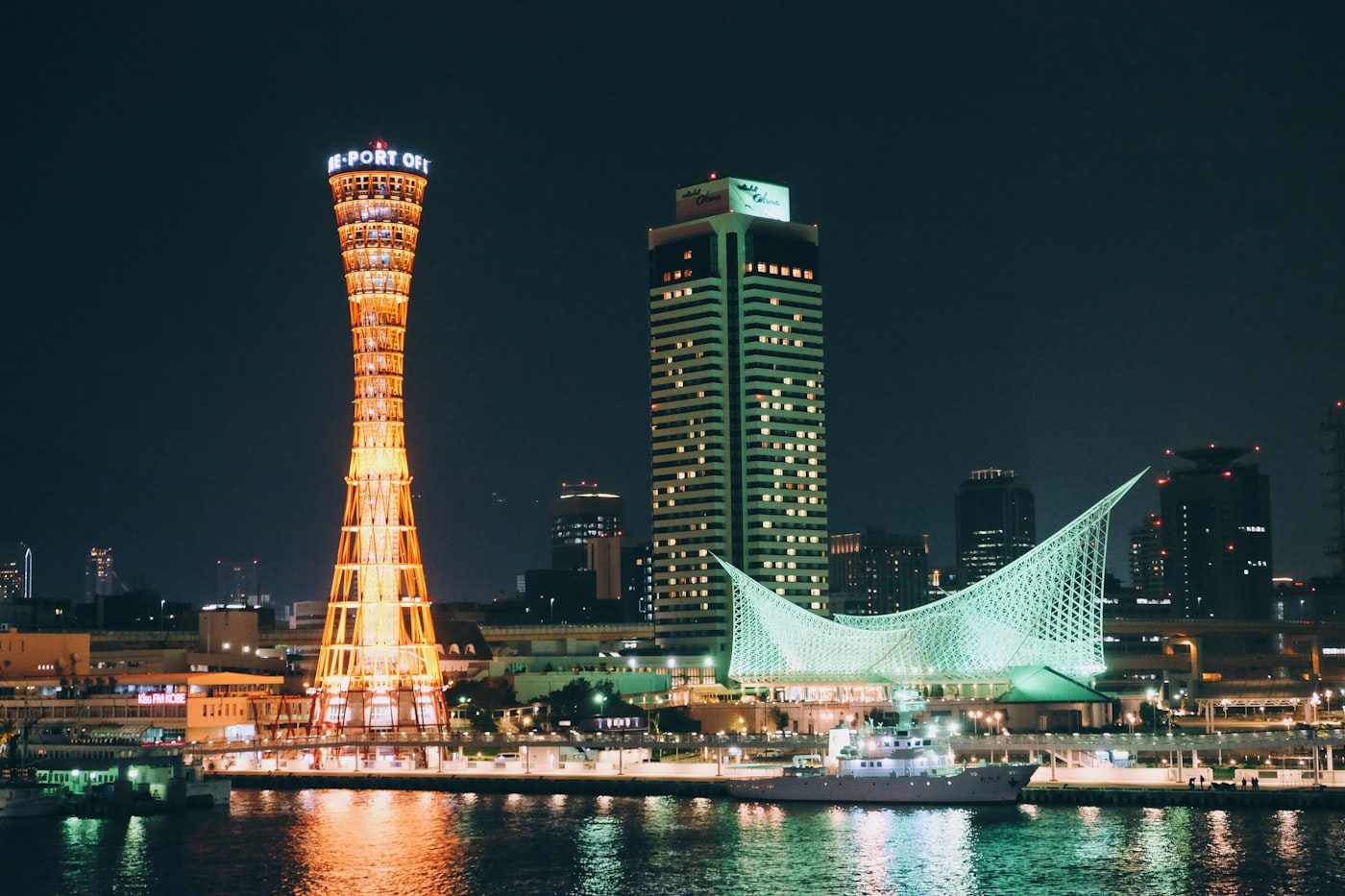 Kobe Port Tower and harbour lit up at night