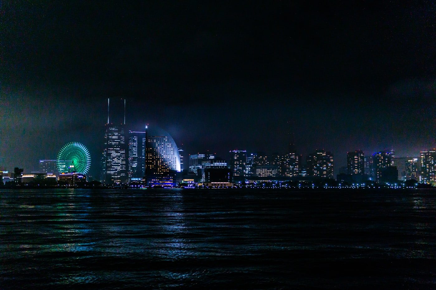 The Minato Mirai skyline lit up at night in Yokohama