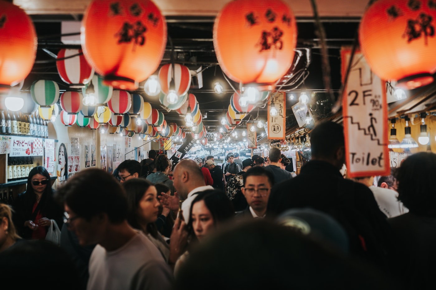 Crowds browsing the covered stalls of Nishiki Market in Kyoto